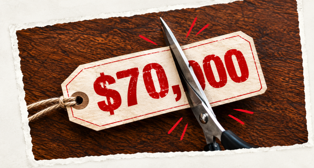 Scissors cutting a $70,000 price tag to illustrate lower cash recycler costs.